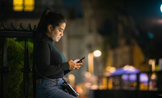 a woman using an app on a smartphone