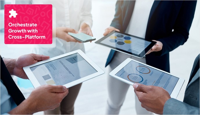 4 users holding different types of gadgets like tablet and mobile phone representing cross-platform orchestration