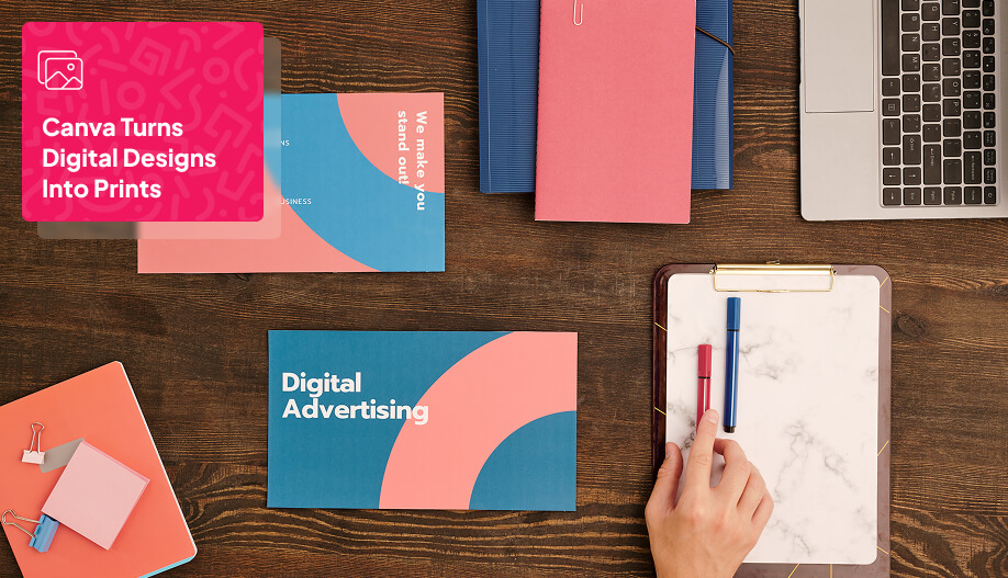 top view of the table with books, pen, and laptop on it