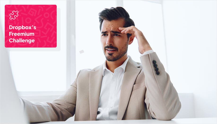 a businessman showing confused and stressed face while looking at his computer